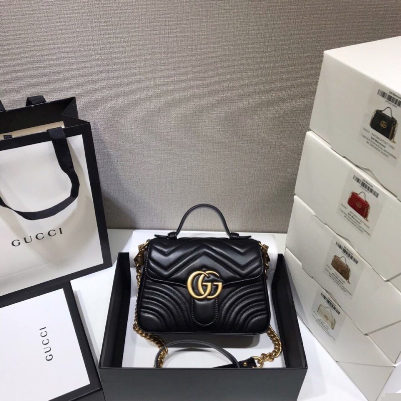 G*u*i top handle bags
